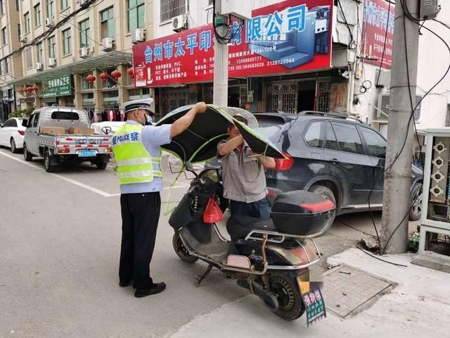 电瓶车|见“伞”就收 见违就纠